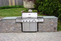 Outdoor Kitchens (20) Built in freestanding grill with bluestone tops
